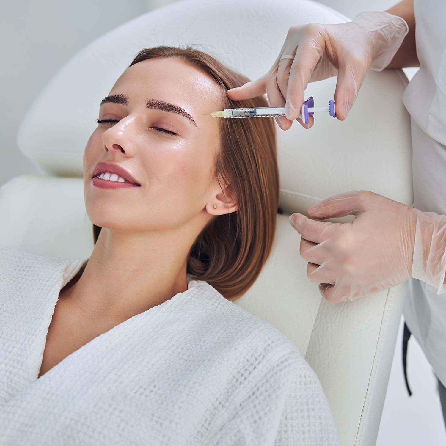 adorable pretty lady in white bathrobe receiving p D34U8UB